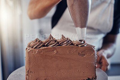 Piping, bakery and hands of baking a chocolate cake in a kitchen or pastry chef cooking a recipe. Food, dessert and cook preparing a sweet meal in Brazil and adds cream from a bag