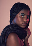 Portrait, hair and makeup with a model black woman in studio on a wall background for natural haircare. Face, beauty and braids with an attractive young female posing to promote keratin treatment