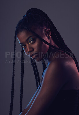 Buy stock photo Beauty, makeup and portrait of a black woman in a studio with braids, cosmetic and natural face. Cosmetics, beautiful and young African female model with a facial treatment by a dark gray background.