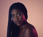 Portrait, face and hair with a model black woman in studio on a wall background for natural haircare. Makeup, beauty and braids with an attractive young female posing to promote keratin treatment