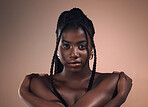 Portrait, hair and braids with a model black woman in studio on a wall background for natural haircare. Face, beauty and makeup with an attractive young female posing to promote keratin treatment