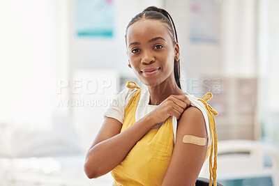 Buy stock photo Portrait, covid or vaccine and a black woman with a plaster on arm sitting in a hospital. Medical, insurance or healthcare and a female in a clinic with a bandaid on shoulder for corona vaccination