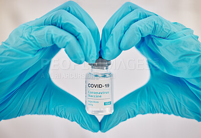 Buy stock photo Covid 19 vaccine, doctor hands and love emoji gesture for healthcare support, medical wellness and safety security medicine. Hospital pharmacy, nurse or pharmacist with vial for immunity vaccination