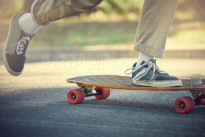 City, street sport and shoes on skateboard for teenage fun, alternative transport or urban fitness. Road, sneakers and free skateboarder feet riding board in park with balance and eco friendly travel