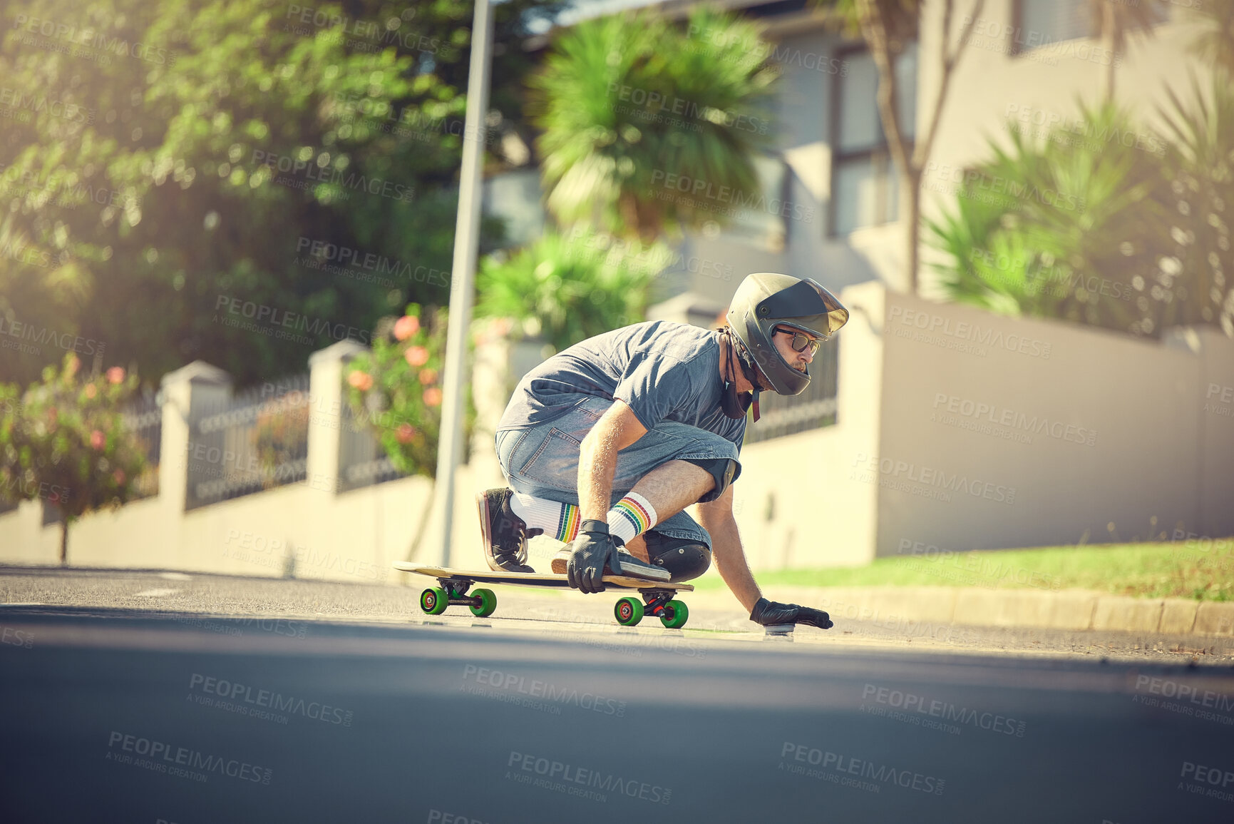 Buy stock photo Skateboard, street and mock up with a sports man skating or training outdoor while moving at speed for action. Fitness, exercise and road with a male skater or athlete outside to practice his balance