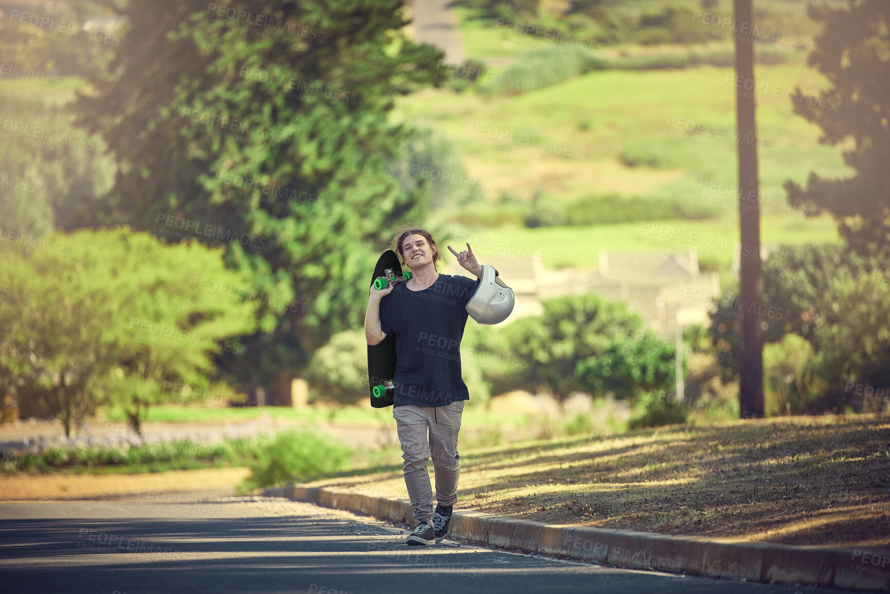 Buy stock photo Rock, carefree and portrait of a man with a skateboard for freedom, fun and urban sport in the street. Happy, trendy and hipster skateboarding in the road for physical activity in nature of Norway