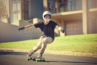 Skateboard, training or mockup with a sports man skating on a street outdoor while moving at speed for action. Fitness, exercise and road with a male skater or athlete outside to practice his balance