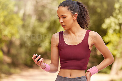 Buy stock photo Fitness, woman and checking stop watch for running exercise, workout or training in the nature outdoors. Active female runner looking at time for monitoring run, steps or cardio performance tracking