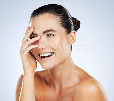 Buy stock photo Beauty, skincare and hand on face of a woman in studio with a smile for natural cosmetic product. Aesthetic model person happy about makeup, facial and dermatology for skin glow and spa wellness