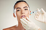 Skincare, collagen and portrait of woman with injection in lips from healthcare professional, anti aging treatment in studio. Beauty, model and aesthetic facial lip filler syringe on white background