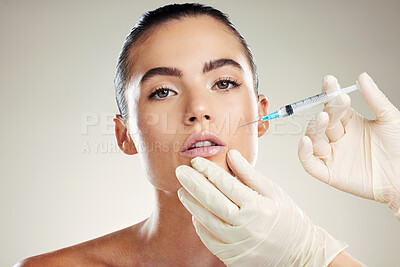 Buy stock photo Skincare, collagen and portrait of woman with injection in lips from healthcare professional, anti aging treatment in studio. Beauty, model and aesthetic facial lip filler syringe on background