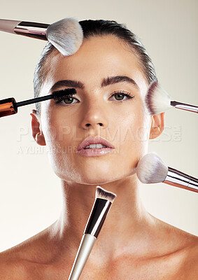 Buy stock photo Makeup brush, beauty and face of a woman in studio for cosmetic product advertising. Aesthetic model person with skin tools for facial skincare and dermatology with glow using mascara and foundation