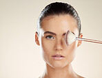 Portrait, face and brush for makeup with woman in beauty mockup, skincare and cosmetics isolated on studio background. Foundation, glow and cosmetic tools, healthy skin and wellness with microblading