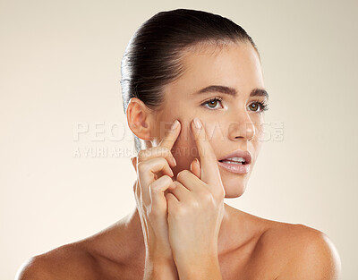 Buy stock photo Face, hands and blackhead with a woman checking or examining her skin for acne problems in studio. Facial, fingers and breakout with an attractive young female indoor to squeeze or pop a pimple