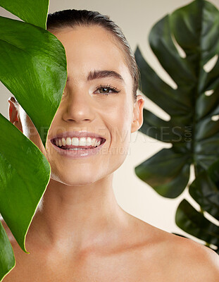 Buy stock photo Beauty, skincare and woman portrait with green plant for natural skin dermatology cosmetic product. Happy face of aesthetic model in studio for sustainable glow or makeup for health and wellness