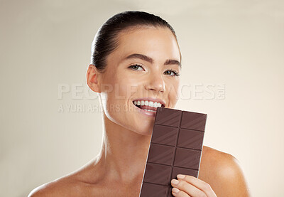 Buy stock photo Beauty portrait, eating and woman with chocolate bar, junk food or dessert for sugar sweets, candy snack or cheat meal. Cosmetics makeup, skincare and hungry model with cacao product for antioxidants