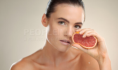 Buy stock photo Beauty, grapefruit squeeze and skincare woman portrait in studio with natural fruit cosmetic product. Face of model person with healthy vitamin c food for dermatology, skin glow and self care