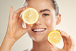 Beauty, face portrait and happy woman with lemon for natural fruit detox, health wellness or facial skincare glow. Spa salon, dermatology healthcare and nutritionist model with vitamin c food product
