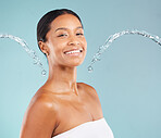 Black woman, portrait and skincare with water, blue background and cleaning cosmetics in studio. Face of female model, body shower and beauty for healthy skincare, happy wellness or facial aesthetics