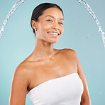 Smile, water splash and beauty portrait of black woman in studio, body cosmetics and blue background. Face of female model, shower drops and spa for healthy skincare, wellness and cleaning aesthetics