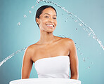 Water splash, bathroom and portrait of black woman on blue background, studio and beauty cosmetics. Face of happy female model, shower and cleaning for healthy skincare, wellness and facial aesthetic