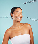 Happy black woman, portrait and water splash in studio for cleaning cosmetics on blue background. Face of female model, shower drops and beauty for healthy skincare, wellness and facial aesthetics 