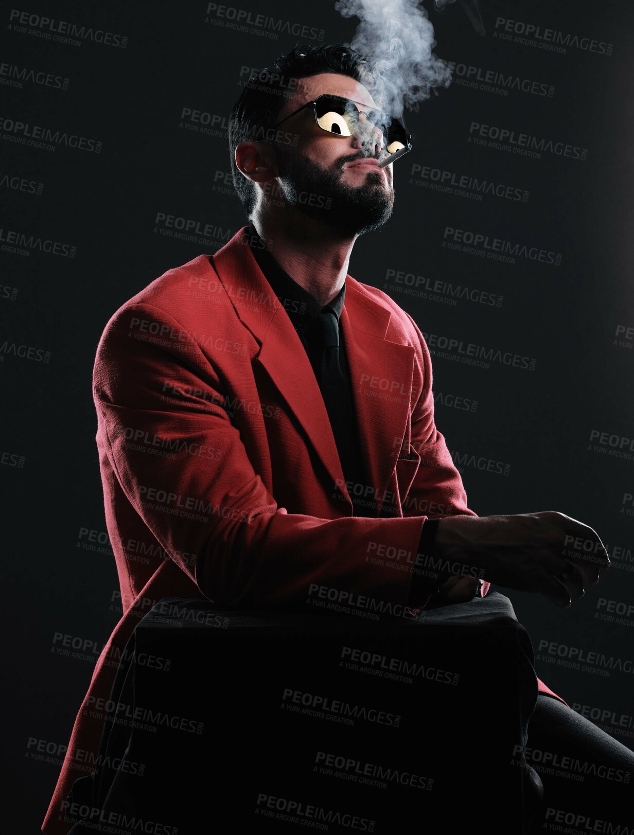 Buy stock photo Man in red suit, smoking and fashion with style, trendy and guy on dark studio background. Mafia, male and gentleman with elegant outfit, edgy and cigarette with glamour, fancy and black backdrop