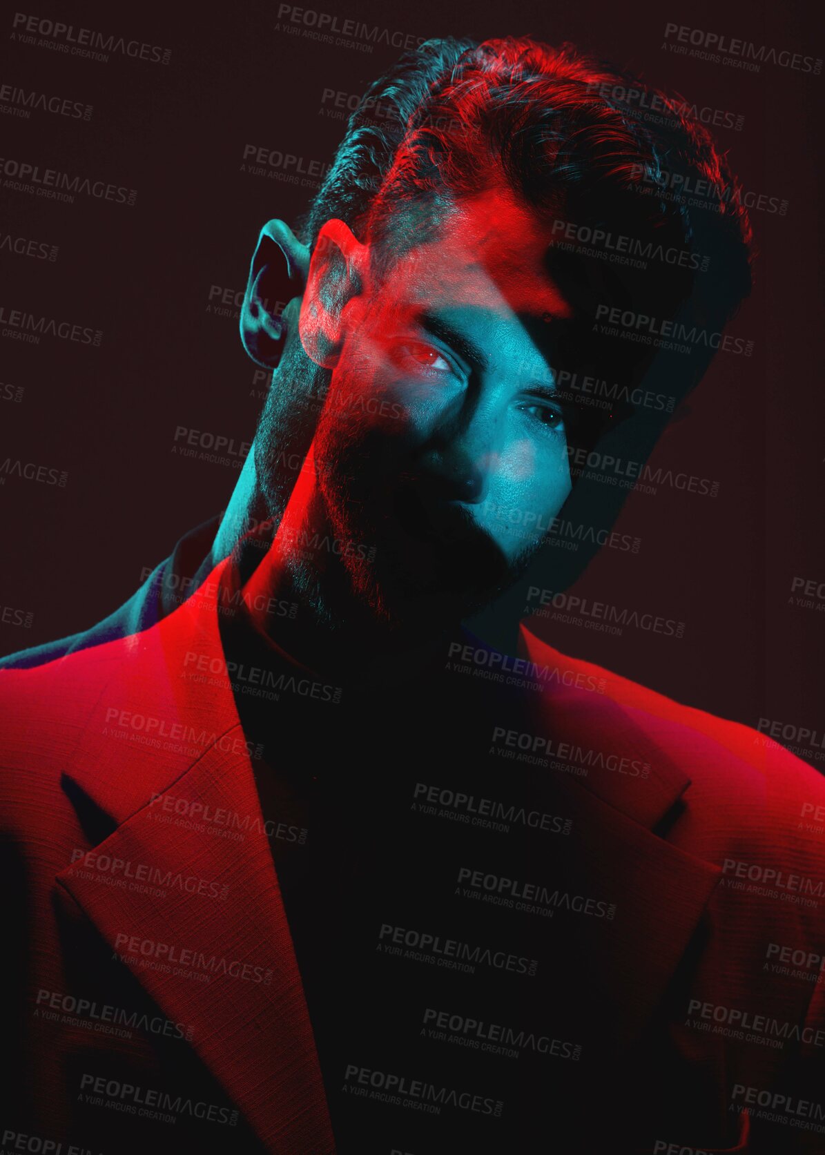 Buy stock photo Art, neon light blur and portrait of man with reflection of lights in eyes in with serious expression on face. Futuristic fashion, male model and beauty with red and blue on dark studio background.