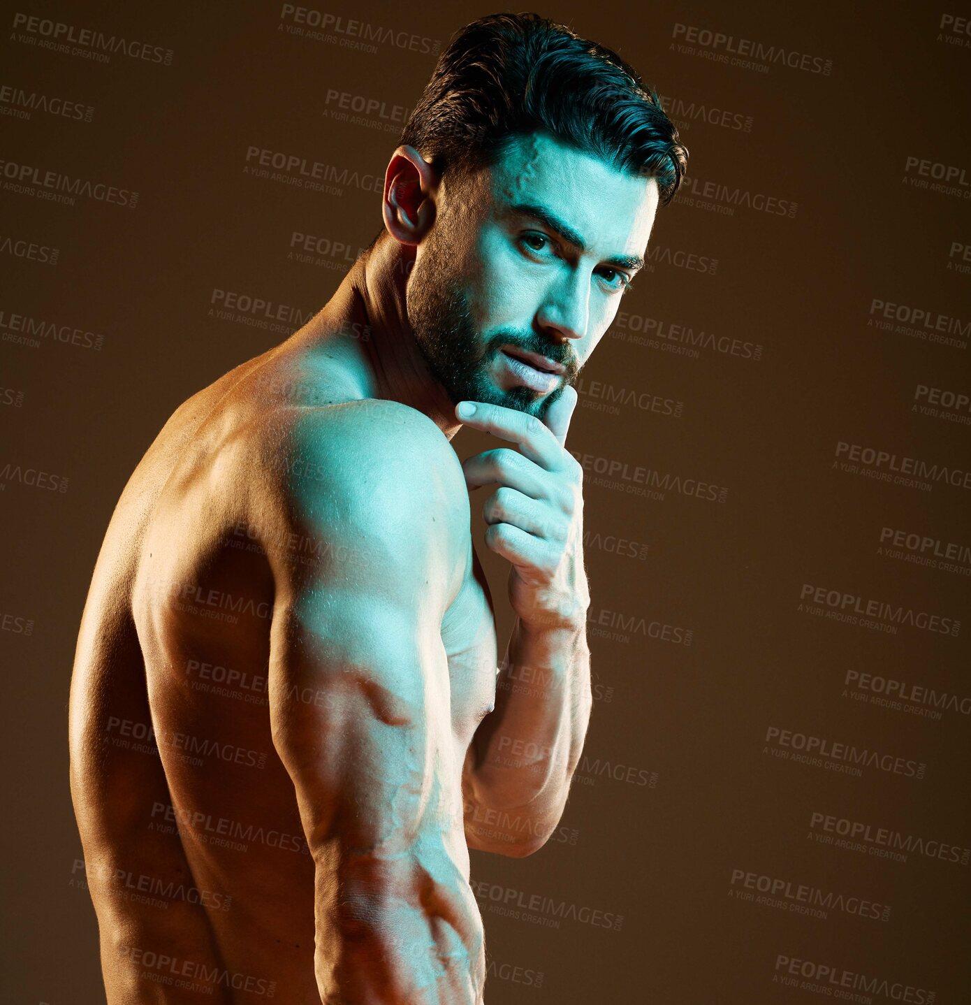 Buy stock photo Sexy, muscular and portrait of a man in a studio with a hot, sensual and attractive pose. Seductive, handsome and young strong male model with biceps, body and muscles posing by a brown background.