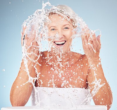 Buy stock photo Shower, face and old woman with smile and water splash, clean skin and antiaging beauty, elderly model isolated on studio background. Senior skincare, cosmetics and facial portrait, happy and hygiene