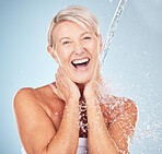 Portrait, old woman and water splash for cleaning, skincare or lady smile on grey studio background. Healthy, senior female or liquid for washing, dermatology or wet for hygiene, clear or smooth skin
