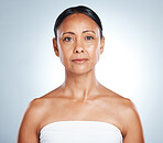 Natural skincare and mature black woman portrait with healthy glow and body care of people in studio. Wellness, aesthetic and dermatology treatment of senior person on isolated gray background.

