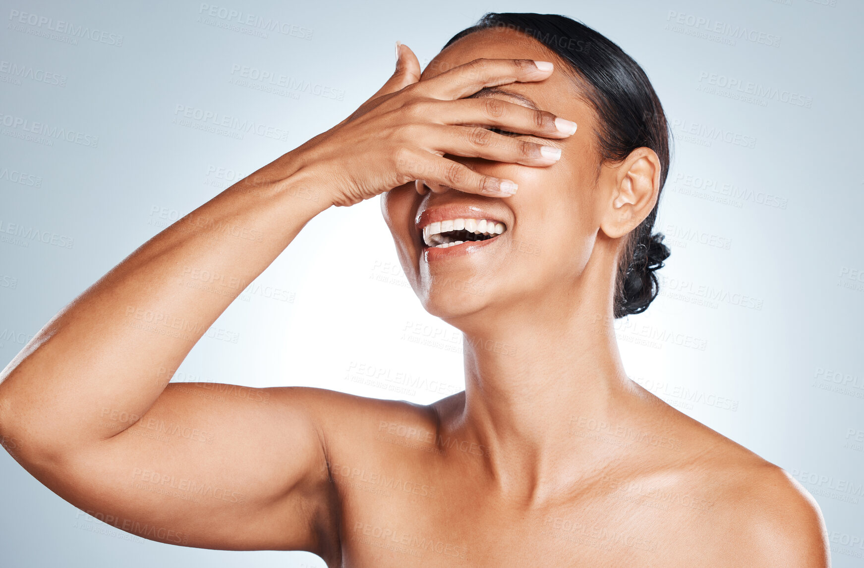 Buy stock photo Happy, laughing and woman in studio for skincare, grooming and hygiene against grey background. Beauty, joy and Mexican girl model relax with wellness, routine and skin treatment, posing and isolated