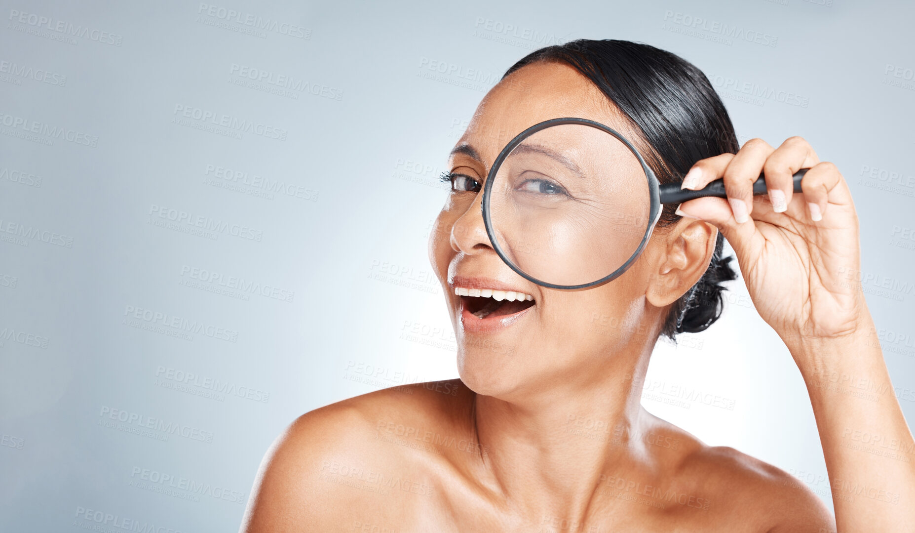 Buy stock photo Magnifying glass, beauty and woman in a studio with a skincare, health and natural face routine. Eye, search and portrait of a mature female with wrinkles for a wellness anti aging facial treatment.