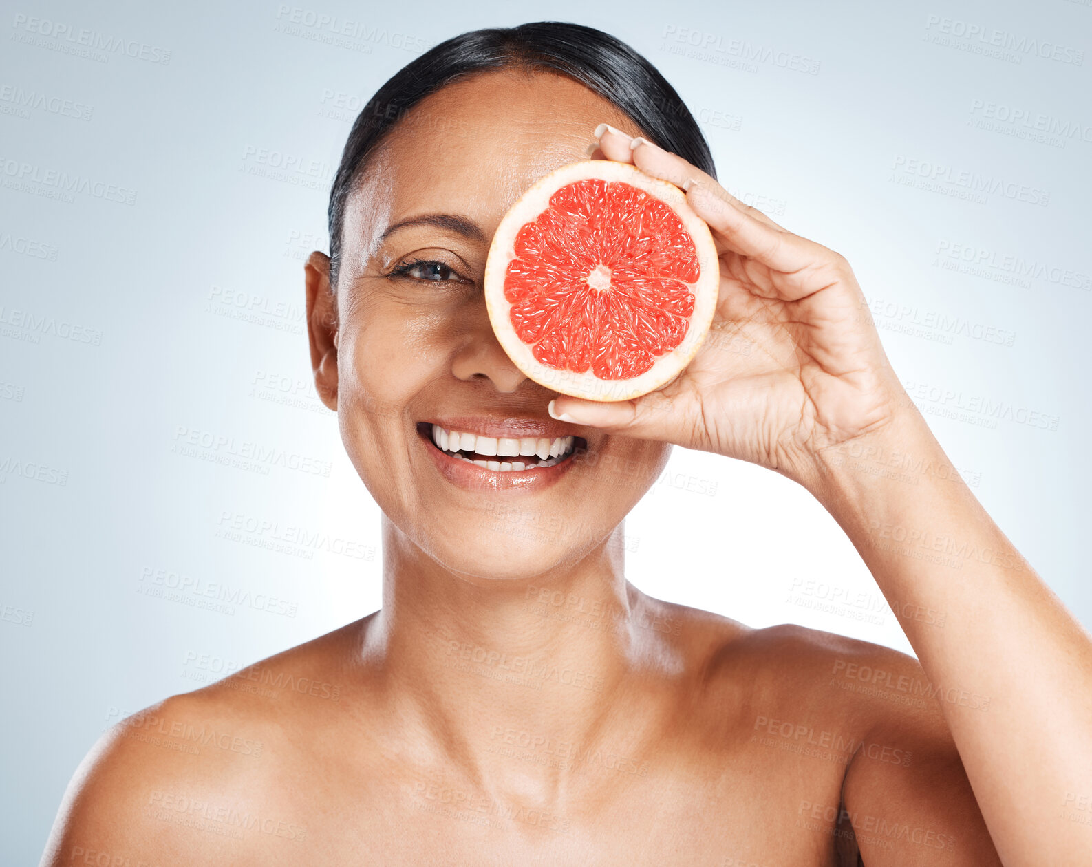 Buy stock photo Grapefruit, woman and vitamin c beauty, portrait and skincare wellness on studio background. Happy model, face and citrus fruits for natural cosmetics, detox and nutrition for healthy aesthetic glow