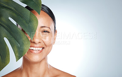 Buy stock photo Skincare, leaf and portrait of woman in studio for skin, product and natural treatment on grey background. Plant, beauty and face of model smile, happy or relax for cosmetic and isolated on mockup