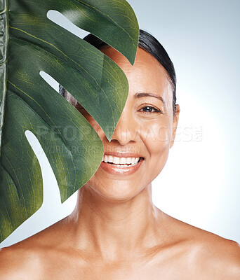 Buy stock photo Leaf, skincare and portrait of woman in studio for skin, product and natural treatment on grey background. Plant, beauty and face of girl model smile, happy or relax for vegan, cosmetic and isolated