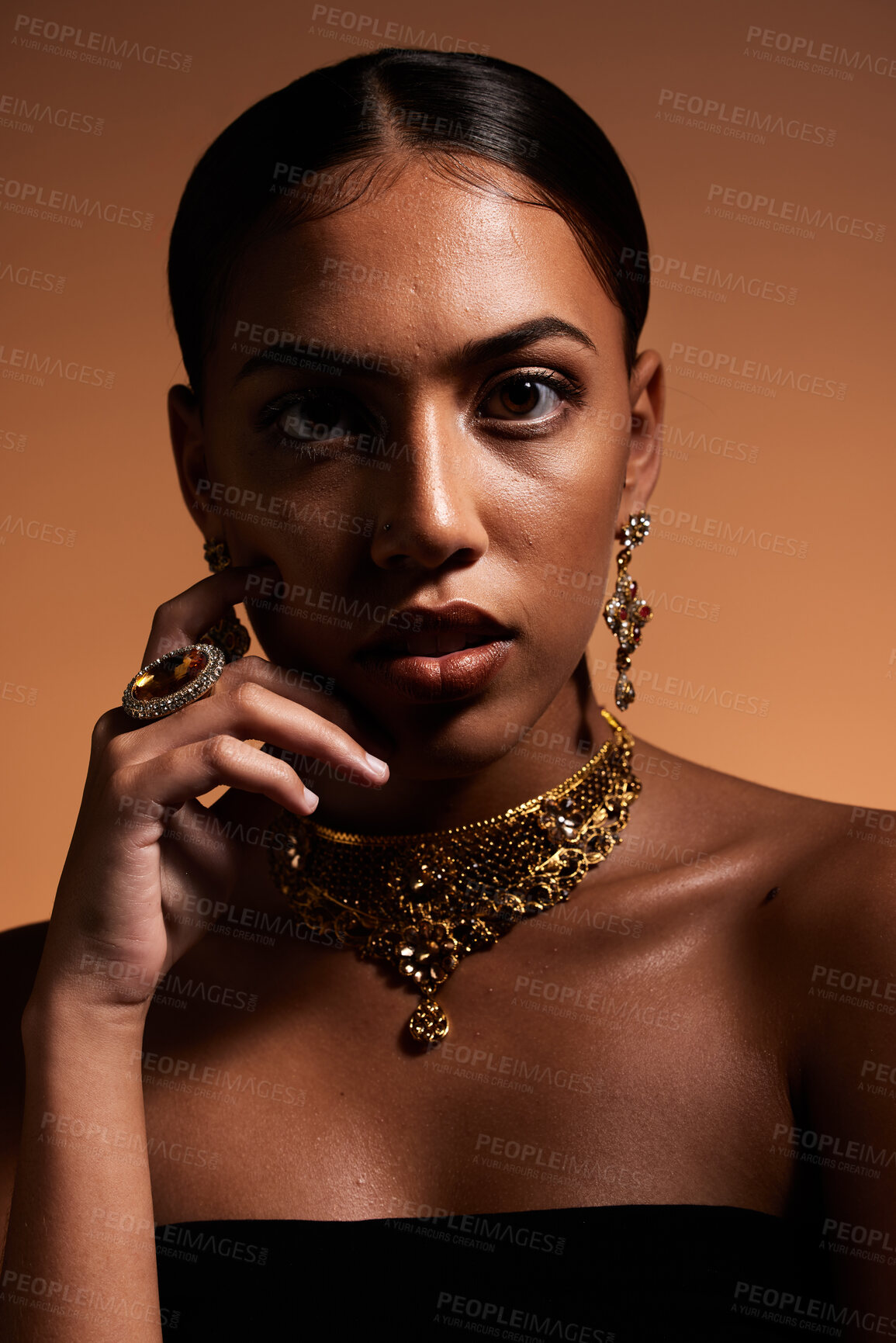 Buy stock photo Fashion, jewellery and portrait of woman in studio for designer, luxury cosmetics and accessories. Beauty, aesthetic and face of Latina girl with elegant, vintage and classy style on brown background