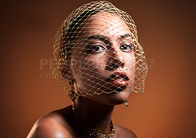 Buy stock photo Stylish, elegant and portrait of a model with a net veil isolated on a brown background in studio. Fashion, vintage and face of a young retro model with a fashionable facial accessory on a backdrop