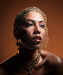 Net veil, classy and face of a woman thinking of fashion isolated on a brown studio background. Elegance, makeup and stylish vintage model with a fancy, retro and glamour accessory on a backdrop