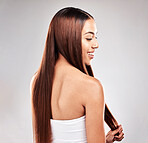 Hair, beauty and back of woman in studio for grooming, healthy hair and salon treatment on grey background. Profile, haircare and happy girl model relax for luxury, keratin and shiny results isolated