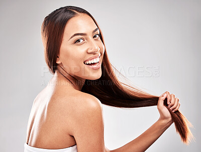 Buy stock photo Portrait, happy and woman in studio with strong hair, healthy and salon treatment on grey background. Face, smile and girl model with shine relax after luxury hairstyle, keratin and isolated