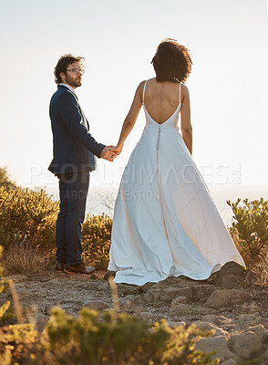 Buy stock photo Wedding, nature or a couple of friends holding hands on a mountain in a romantic celebration of love. Interracial marriage, black woman and happy man in a commitment as bride and groom at sunset