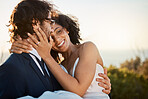 Wedding, marriage and love in nature of a interracial couple happy about trust and commitment. Outdoor, sea and mock up with happiness and smile of bride and man in a suit at a partnership event