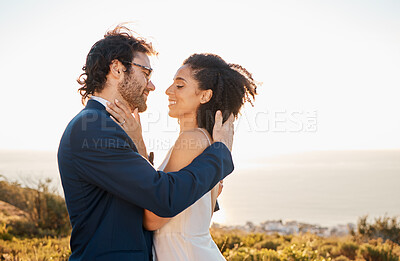 Buy stock photo Love, wedding and bride with groom on mountain for marriage ceremony, commitment and celebration. Romance, happiness and interracial couple bonding, kiss and smile with ocean, nature and outdoors