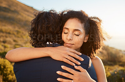 Buy stock photo Hug, trust and couple at sunset wedding with embrace together for care, love and support in married life. Marriage, black woman and man at romantic marriage event in Cape Town, South Africa nature.