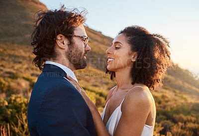 Buy stock photo Wedding, trust and bride with groom on mountain for marriage ceremony, commitment and celebration. Love, intimate embrace and happy interracial couple hug on romantic vacation, honeymoon and holiday