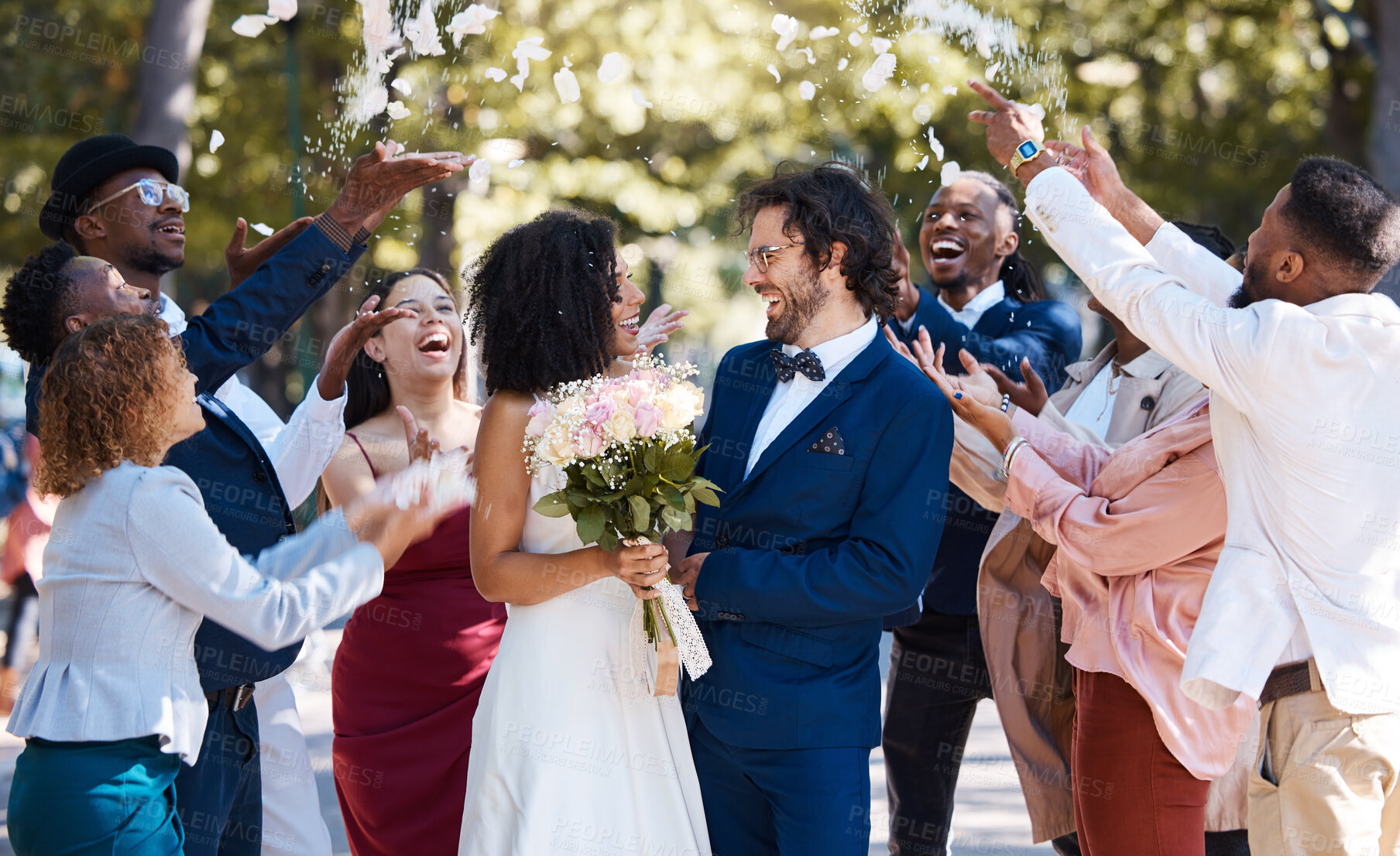 Buy stock photo Confetti, wedding couple and marriage celebration of crowd throwing flower petals outdoor. Happiness, excited and social event with bride and man laughing from love and congratulations applause 