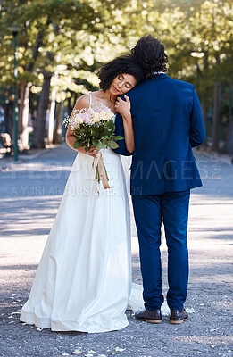 Buy stock photo Wedding, outdoor and couple marriage celebration event for bride and groom together with commitment. Married man and woman at ceremony with trust, partnership and support with flower bouquet and hug