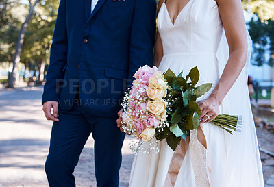 Buy stock photo Flowers, wedding and love of bride, groom and outdoor photograph at celebration, event or reception. Roses, bouquet and marriage of bridal couple, romance and park in commitment, union or partnership